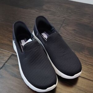 Skechers Black Slip-On Sneakers.